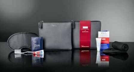 Tumi Leather Travel Bag - Includes Socks + Sleeping Mask + Tooth Brush + Toothpaste + More