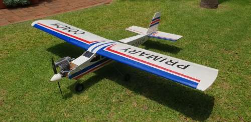 R/C Plane in 7/10 condition. Needs minor attention.  4 Servos, O.S. Max 75AX Two Stroke Glow Engine
