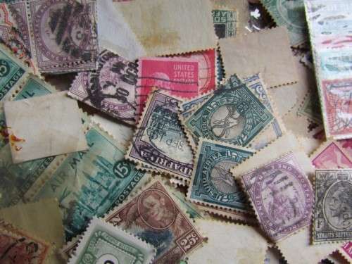 LARGE WORLD LOT UNSORTED/UNCHECKED STAMPS IN WOOD BOX