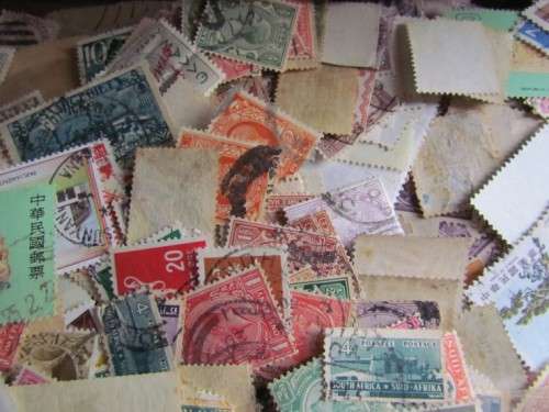 LARGE WORLD LOT UNSORTED/UNCHECKED STAMPS IN WOOD BOX