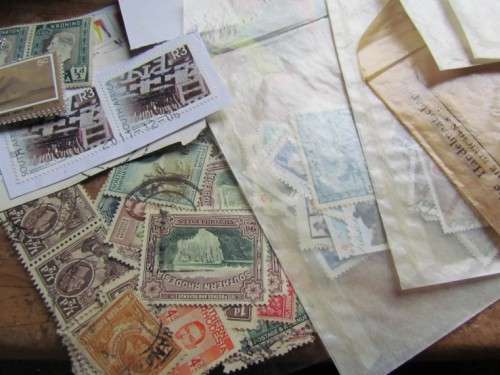 LARGE WORLD LOT UNSORTED/UNCHECKED STAMPS IN WOOD BOX