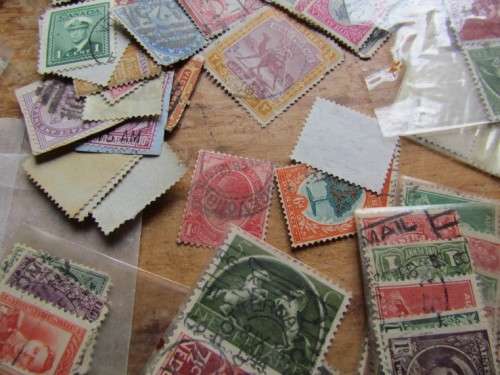LARGE WORLD LOT UNSORTED/UNCHECKED STAMPS IN WOOD BOX