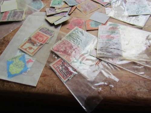 LARGE WORLD LOT UNSORTED/UNCHECKED STAMPS IN WOOD BOX