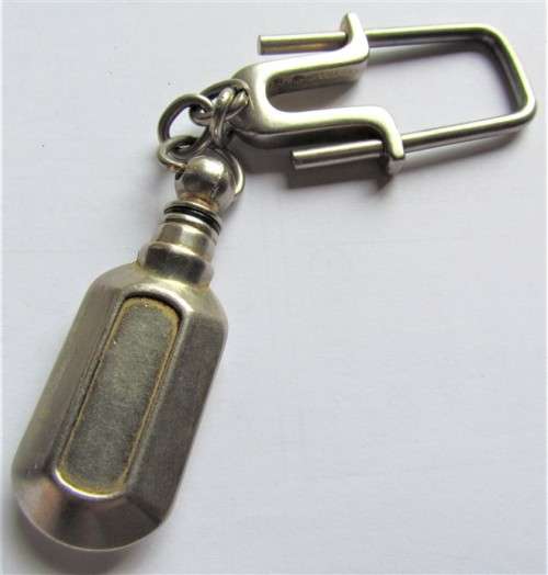 Small heavy metal bottle/cannister - screw open/close on holder