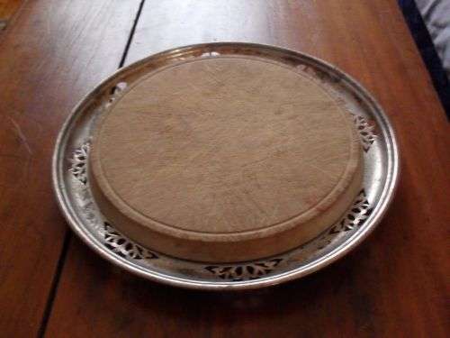 Beautiful Bread Board with Silver Plated Surrounding.