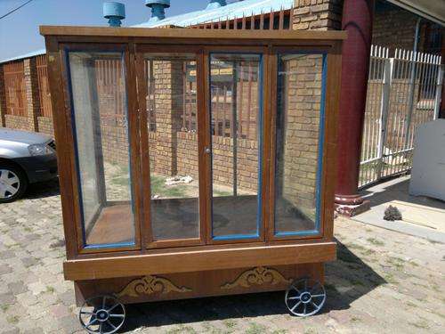 Wooden Carriage with Glass Doors and Metal Wheels - SHOP FURNITURE