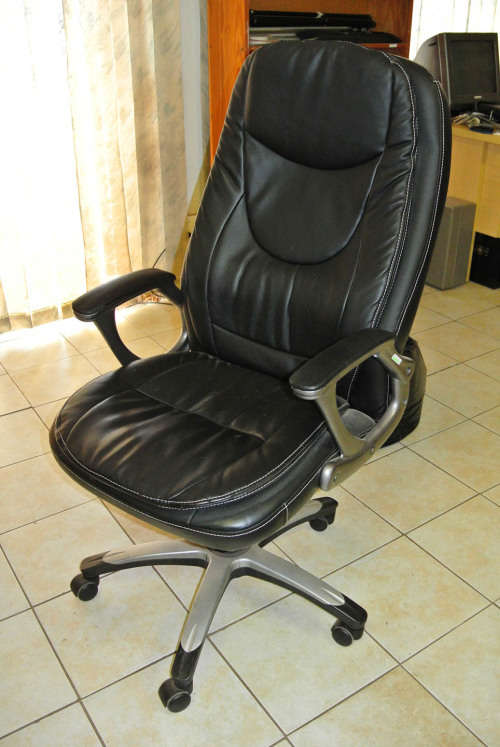 Comfortable Office Chair tilts and swivels on casters in good condition