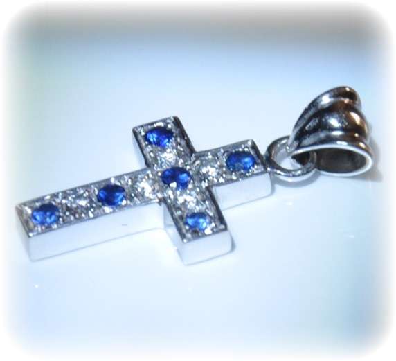 18Ct White Gold cross with 5 diamonds and 6 blue sapphires