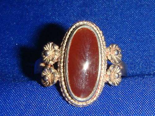 Silver ring with red gemstone