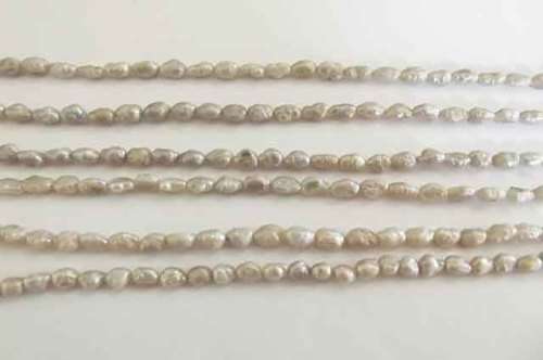 Freshwater Pearls, Uneven Rice ±7mm, Greyish White, ±36cm = 1 x String