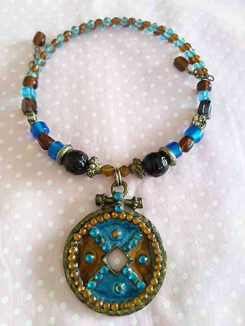 Burtell Necklace, Orange / Brown And Blue Beads On Neckwire, Antique Bronze Pendant With Rhinestones