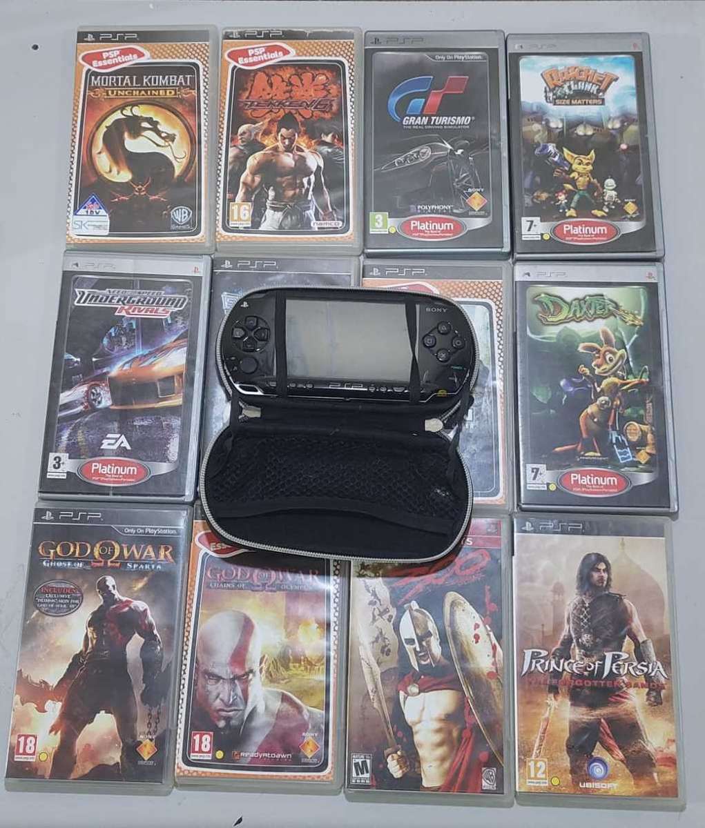 PSP (new battery) + 12 Games (most still have manuals)