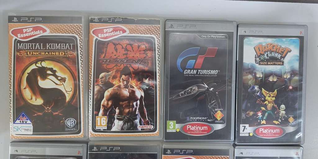 PSP (new battery) + 12 Games (most still have manuals)