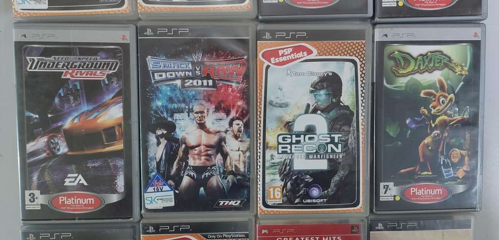 PSP (new battery) + 12 Games (most still have manuals)