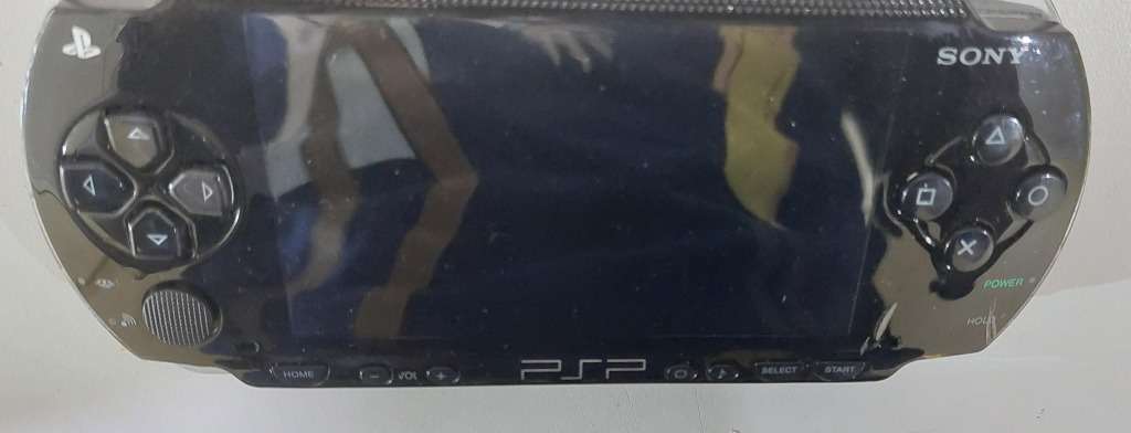 PSP (new battery) + 12 Games (most still have manuals)