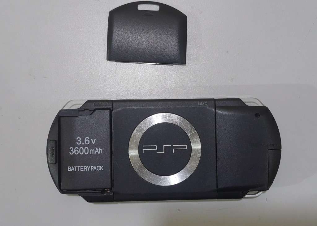 PSP (new battery) + 12 Games (most still have manuals)