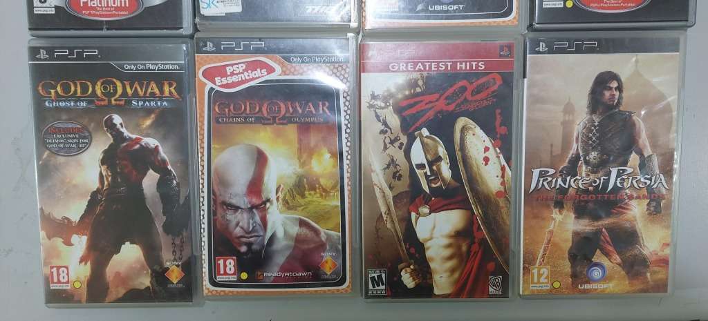 PSP (new battery) + 12 Games (most still have manuals)