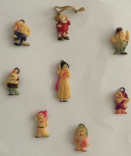 Snow White and the seven dwarfs celluloid charms set (around 1939)