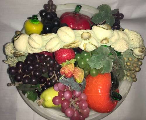 Fruit basket including glass faux fruit