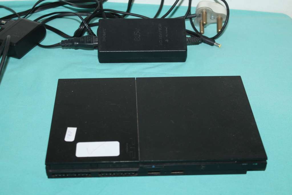 Playstation 2 Slim with 4 games and controller