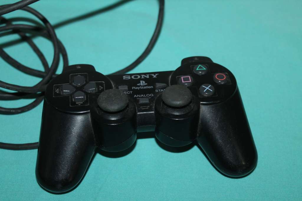 Playstation 2 Slim with 4 games and controller