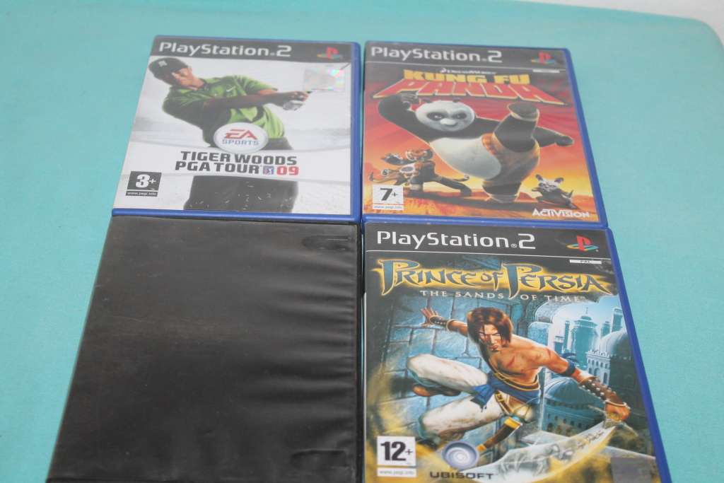 Playstation 2 Slim with 4 games and controller
