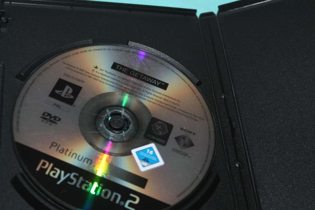 Playstation 2 Slim with 4 games and controller