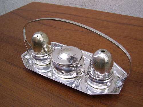 20 th C Silverplated 3 piece cruet set consisting of Salt , Mustard pot and pepper shaker on stand