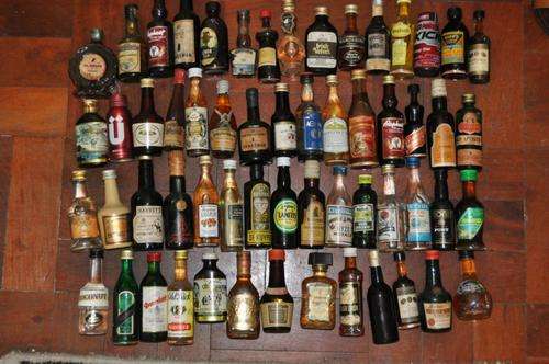 VINTAGE COLLECTION OF 58 SMALL (50ML) BOTTLES OF VARIOUS LIQUERS