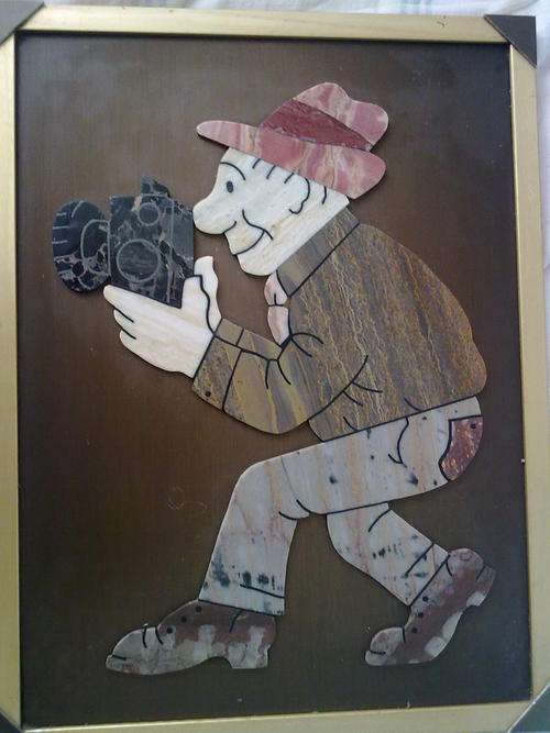 ART DECO stone work "cameraman"