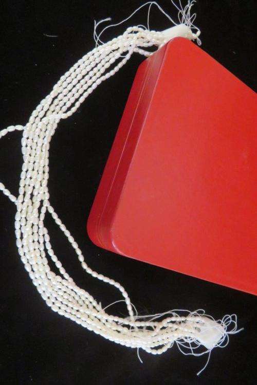 Jewellery case and strings of freshwater pearls