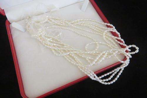 Jewellery case and strings of freshwater pearls