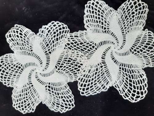2 white acrylic doilies 27cm