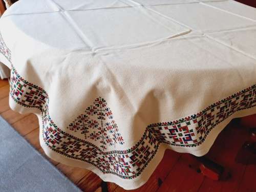 Thick, beige, linen tablecloth with fine cross stitch detail