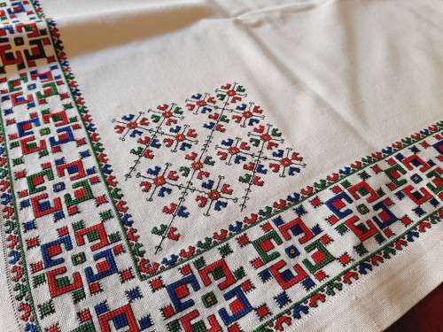 Thick, beige, linen tablecloth with fine cross stitch detail