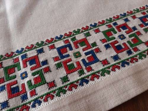 Thick, beige, linen tablecloth with fine cross stitch detail