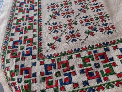 Thick, beige, linen tablecloth with fine cross stitch detail