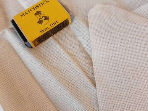 Pieces of cross stitch canvas