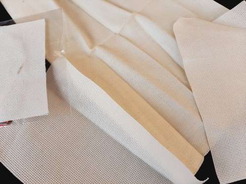 Pieces of cross stitch canvas