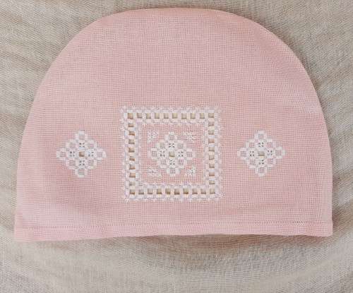 Pink tea cosy with hardanger needlework