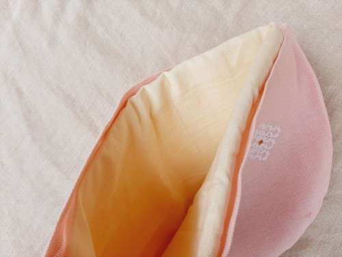 Pink tea cosy with hardanger needlework