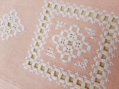 Pink tea cosy with hardanger needlework