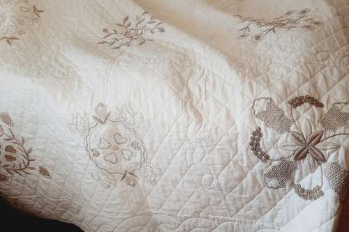 Lovely cream quilt - embroidered - square 180 x 180cm - good condition