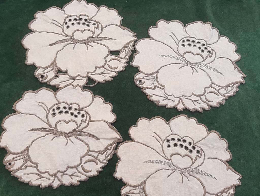 Four small embroidered linen doilies or coasters - 15cm