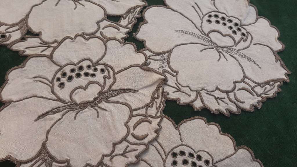 Four small embroidered linen doilies or coasters - 15cm