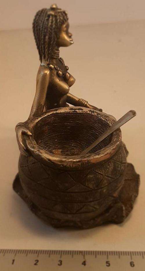 Bronze colour African lady with cooking pot and spoon