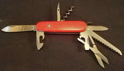 Victorinox Swiss Army knife (Huntsman)Older model Grooved Cork screw Orange/Red scales