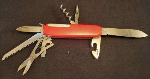 Victorinox Swiss Army knife (Huntsman)Older model Grooved Cork screw Orange/Red scales