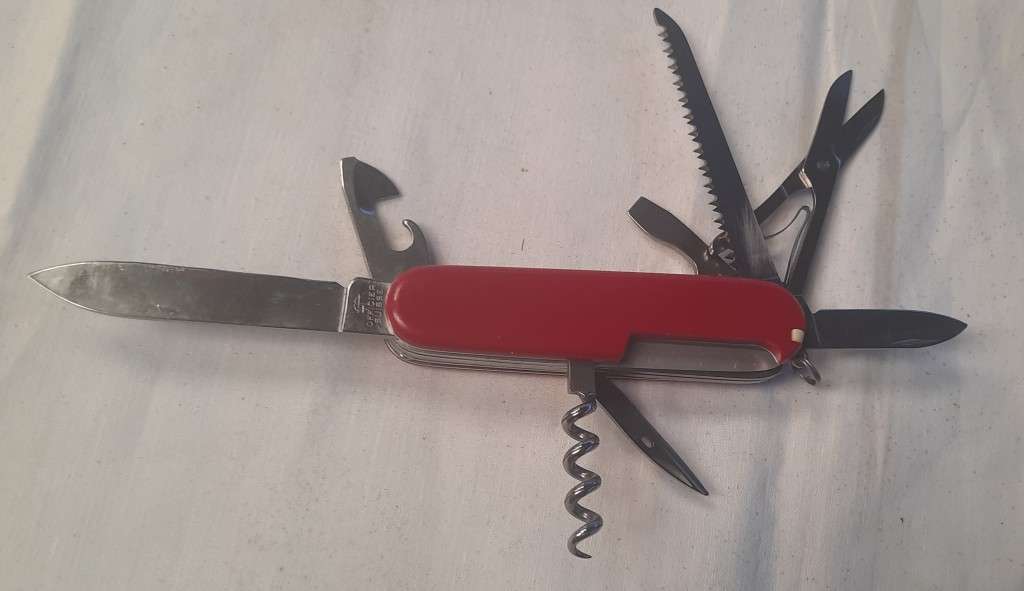 Victorinox Swiss Army knife (Huntsman)Older model Red scales Grooved cork screw Logo on scale