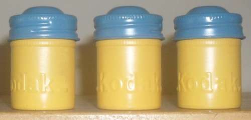 KODAK FILM TINS AND WOODEN FILM ROLL HOLDERS. SEE ILLUSTRATIONS.